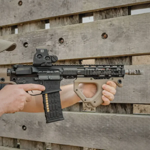 Close-up of shooter gripping HERA Arms CQR Gen 1.0 Front Grip in FDE on AR-15