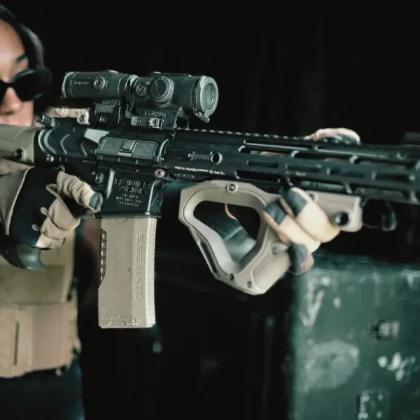 Model demonstrating the Hera Arms CQR Gen 2.0 OD Green front grip mounted on an AR-15, highlighting ergonomic design and integrated QD sling swivel mount.​